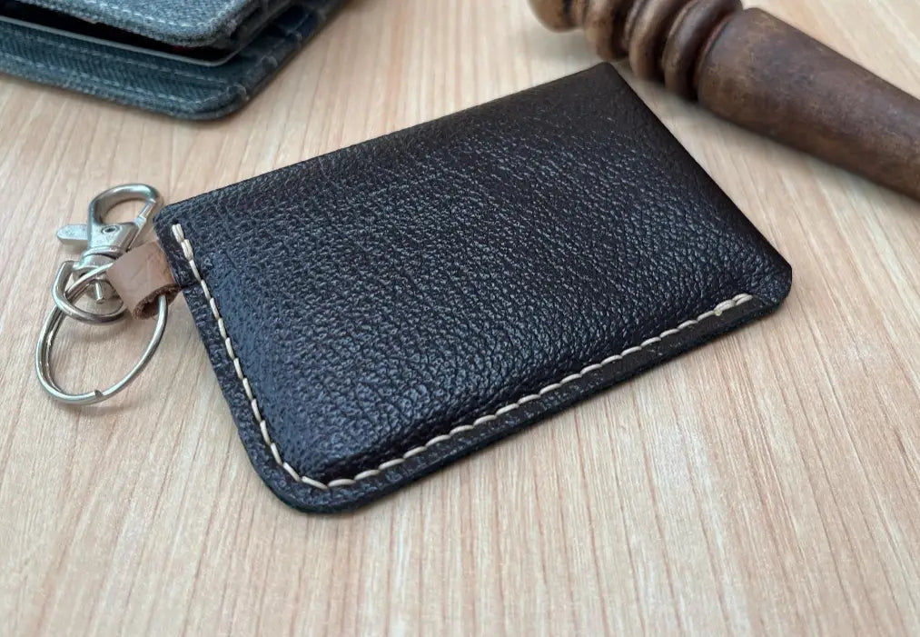 Back view of a minimalist leather card wallet handmade from soft chrome tanned leather.