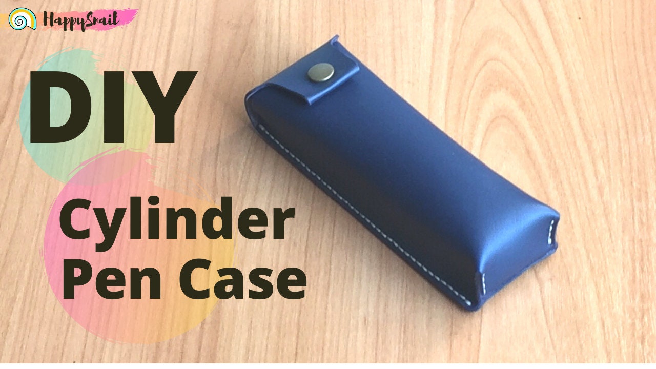 A blue leather rectangle pen case with a snap closure, labeled 'DIY Cylinder Pen Case'.