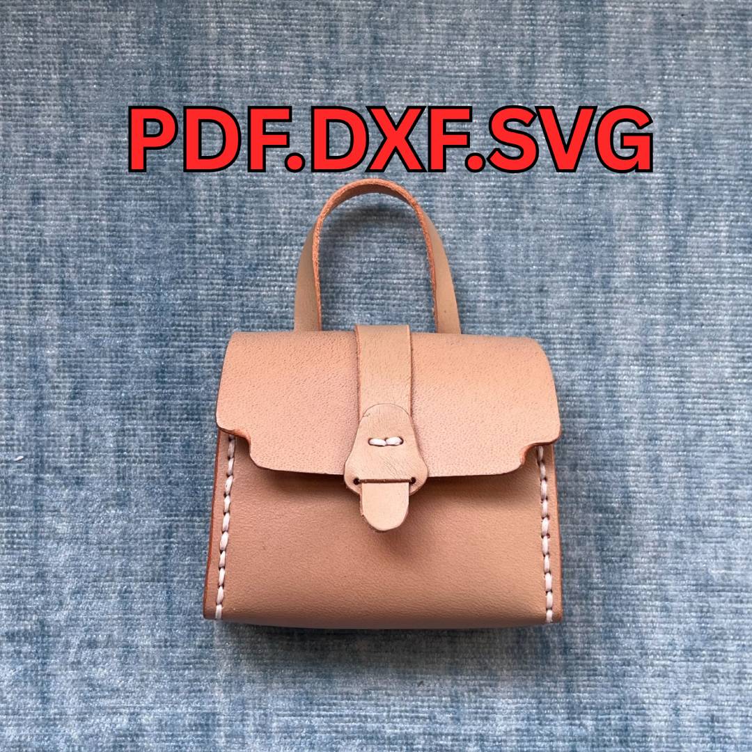 DIY Miniature tan leather satchel showing tiny scale and detail.