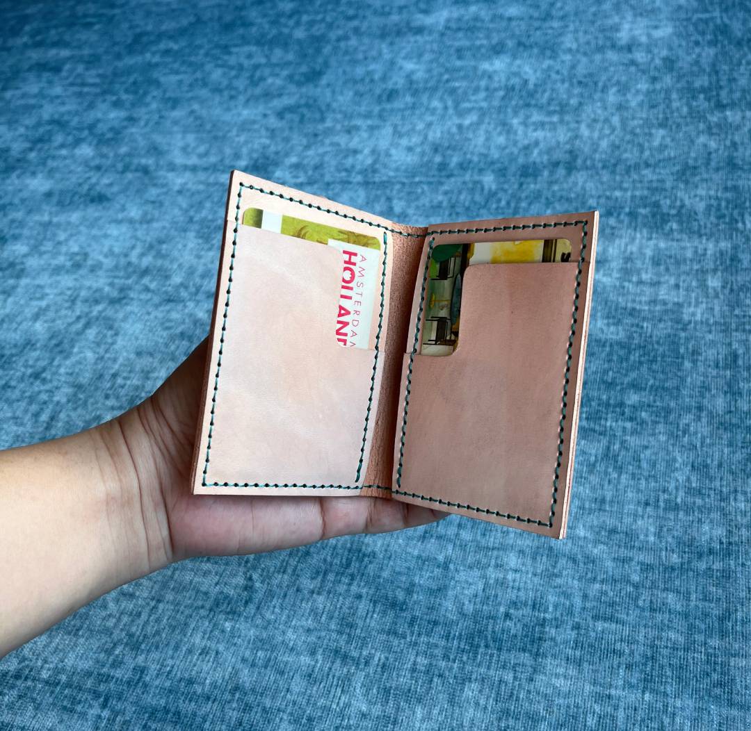 A DIY handmade leather card wallet holding 4 to 6 cards.