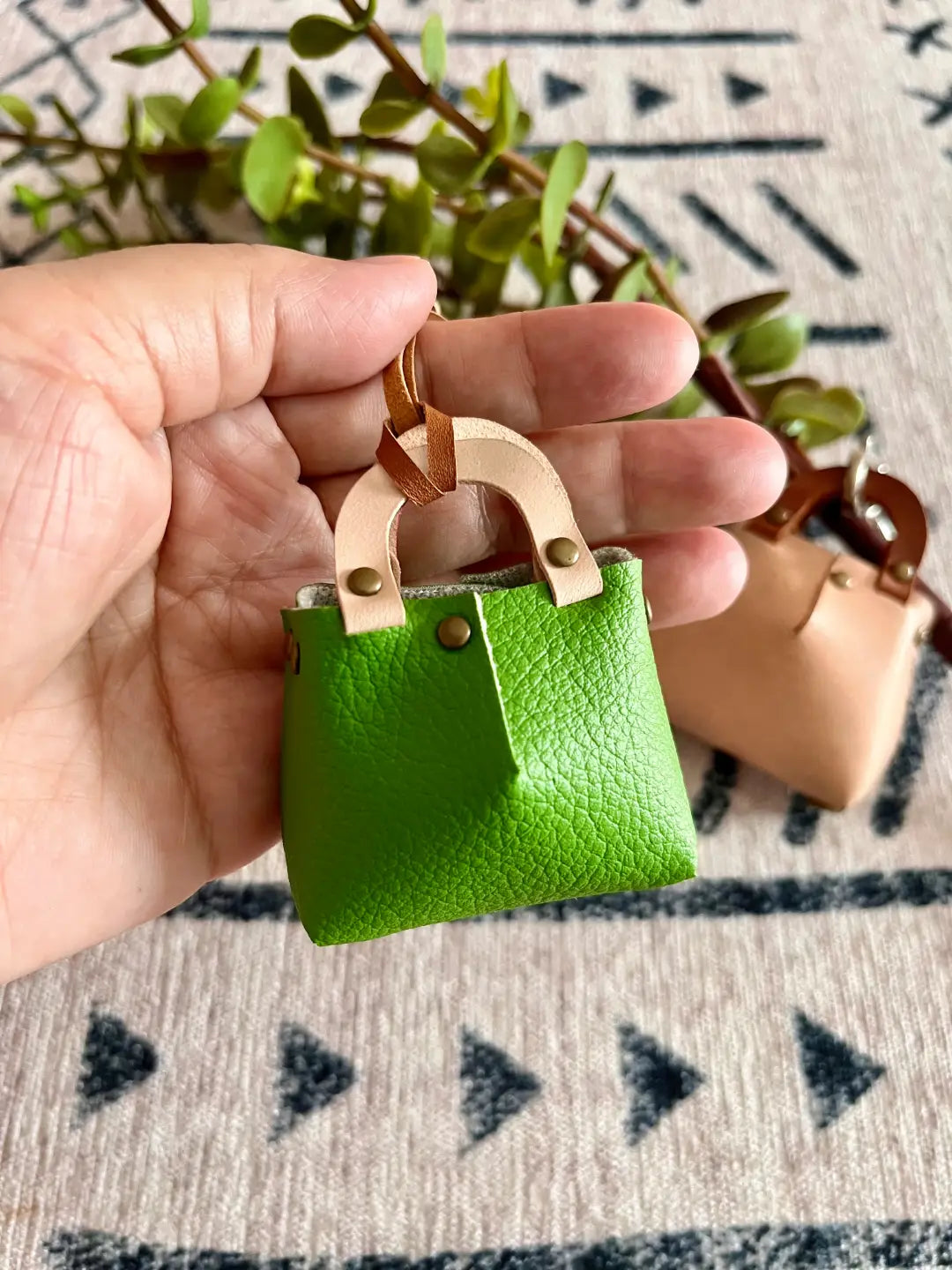 Close-up of a handmade luxury tiny bag charm.