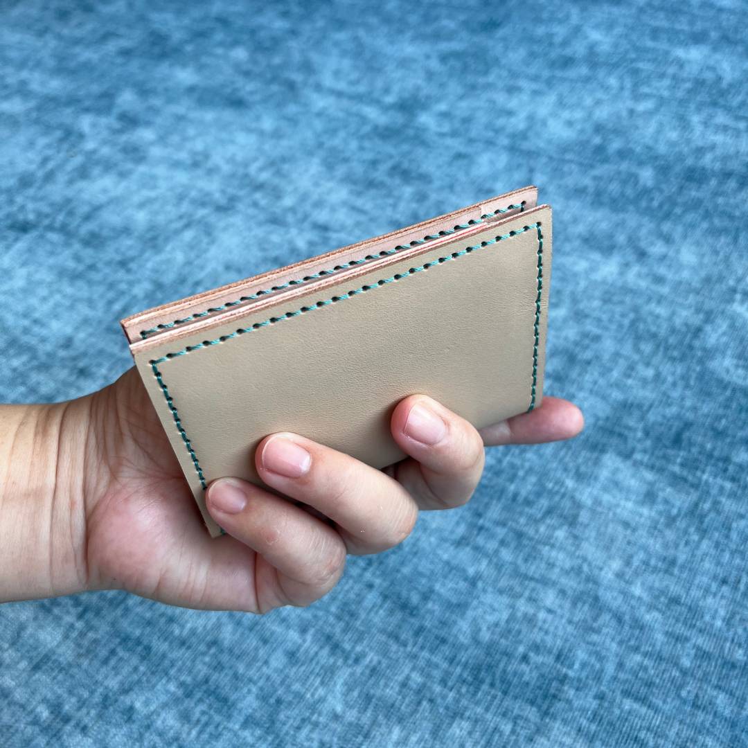 Minimalist handmade leather card  holder wallet for holding 6 cards.