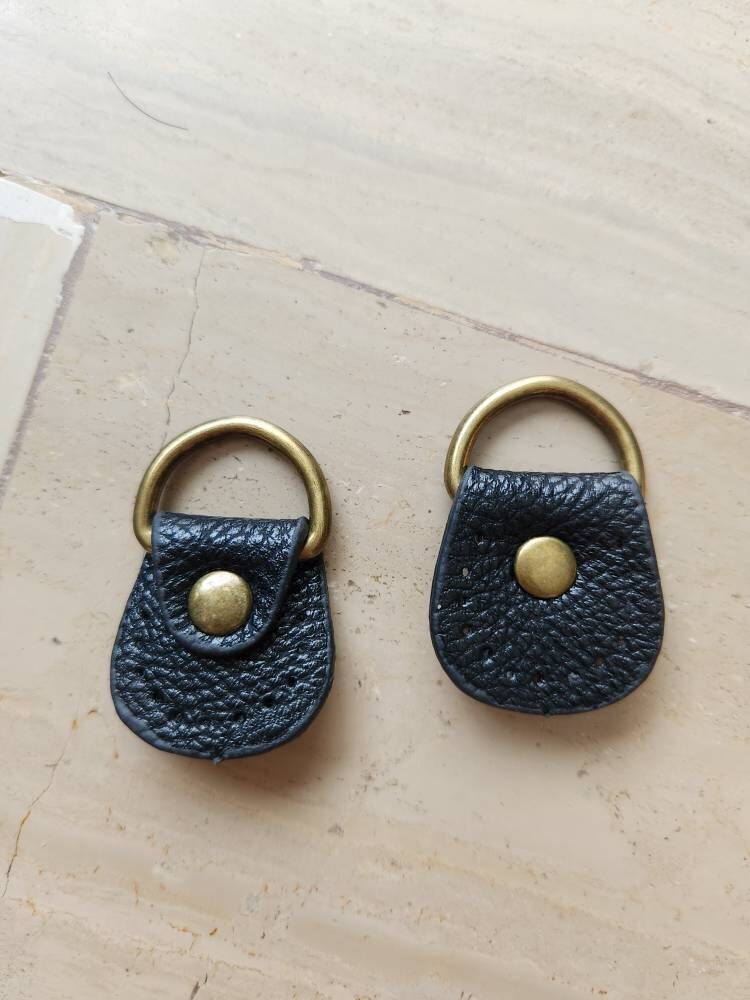 2 completed Light brown and blue square leather keychain with white stitching on a brass ring,