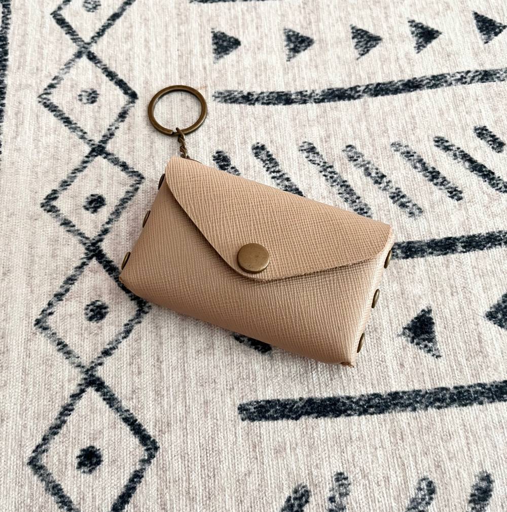 Leather card holder attached to a sling bag using keyring