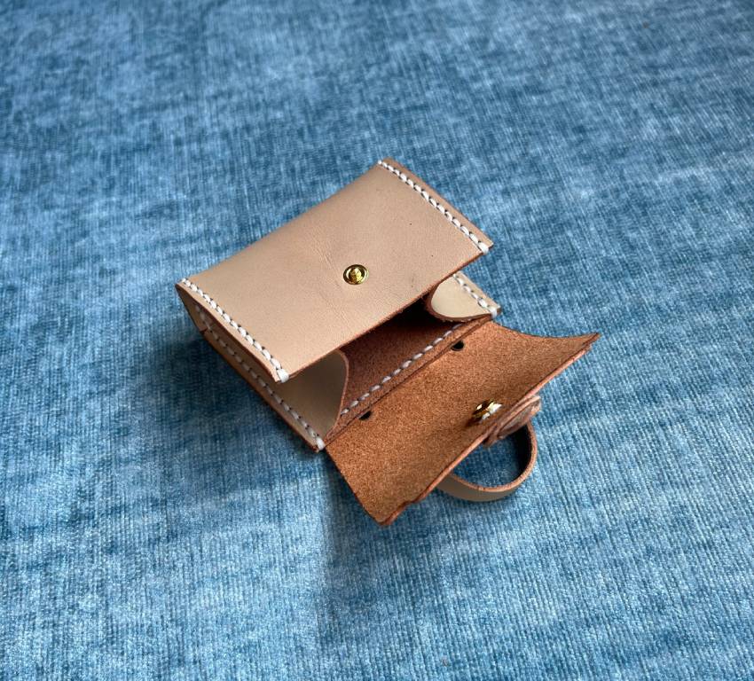 Close up view of hand sew leather mini-bag