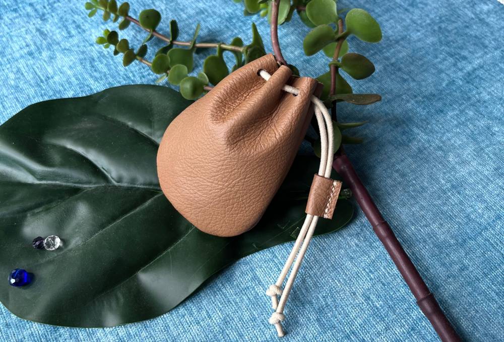 DIY budget-friendly leather drawstring pouch.
