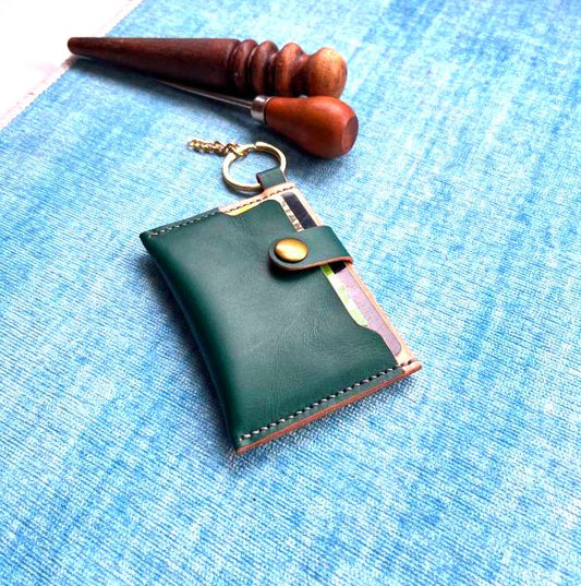 Technical blueprint for leather card holder with exact stitching hole marks.