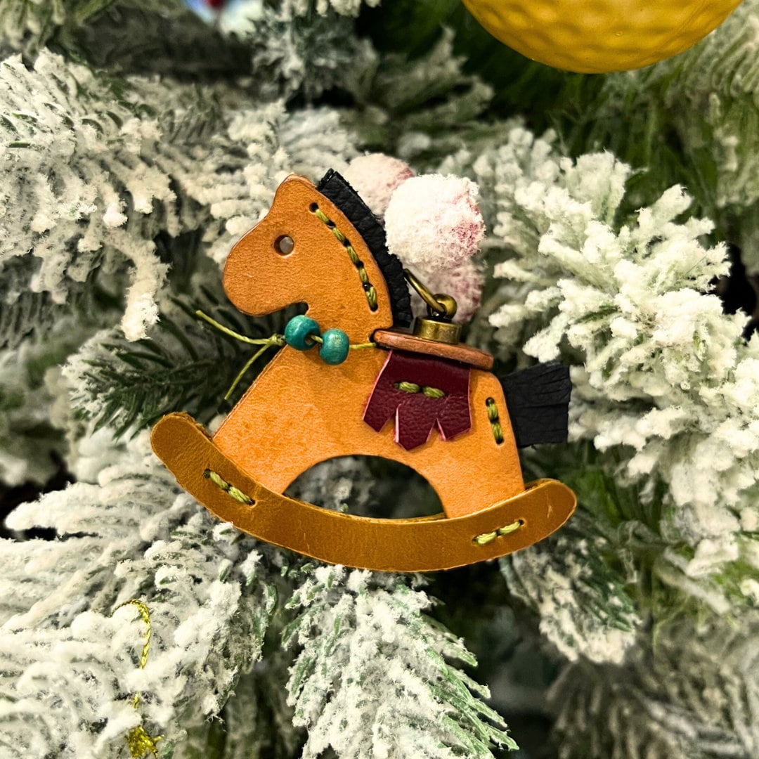 Finished leather horse keychain from a DIY craft pattern and template.