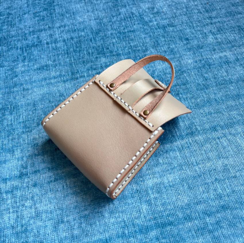 the back view of a handsew leather bag