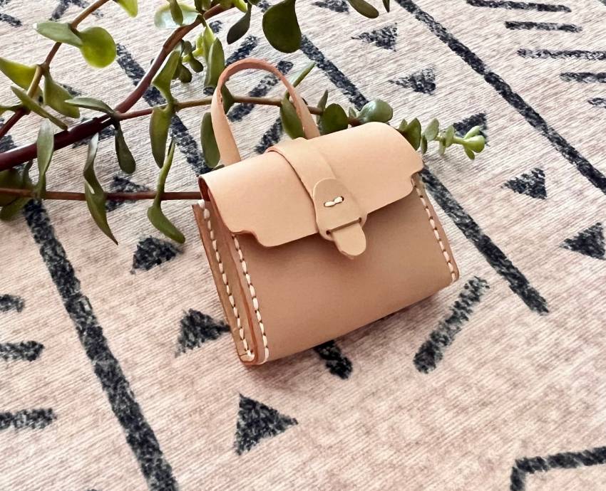 Close-up  view of vegetable tanned leather used for making tiny satchel.