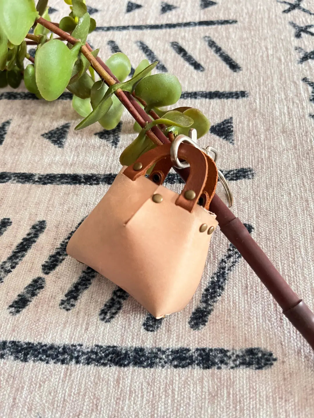 close up a brown color mini bag charm for bag decoration for my girl friend.