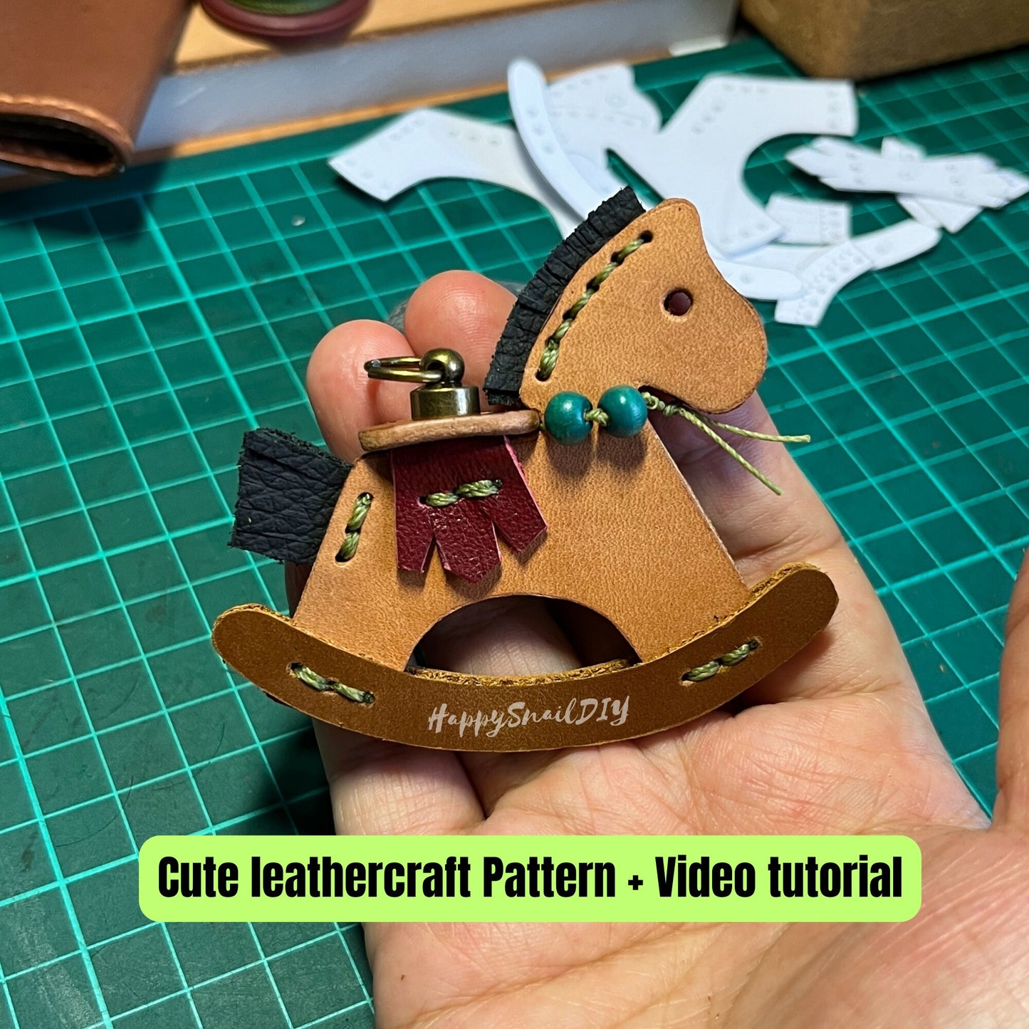 Simple yet elegant leather horse head silhouette keychain in caramel brown.