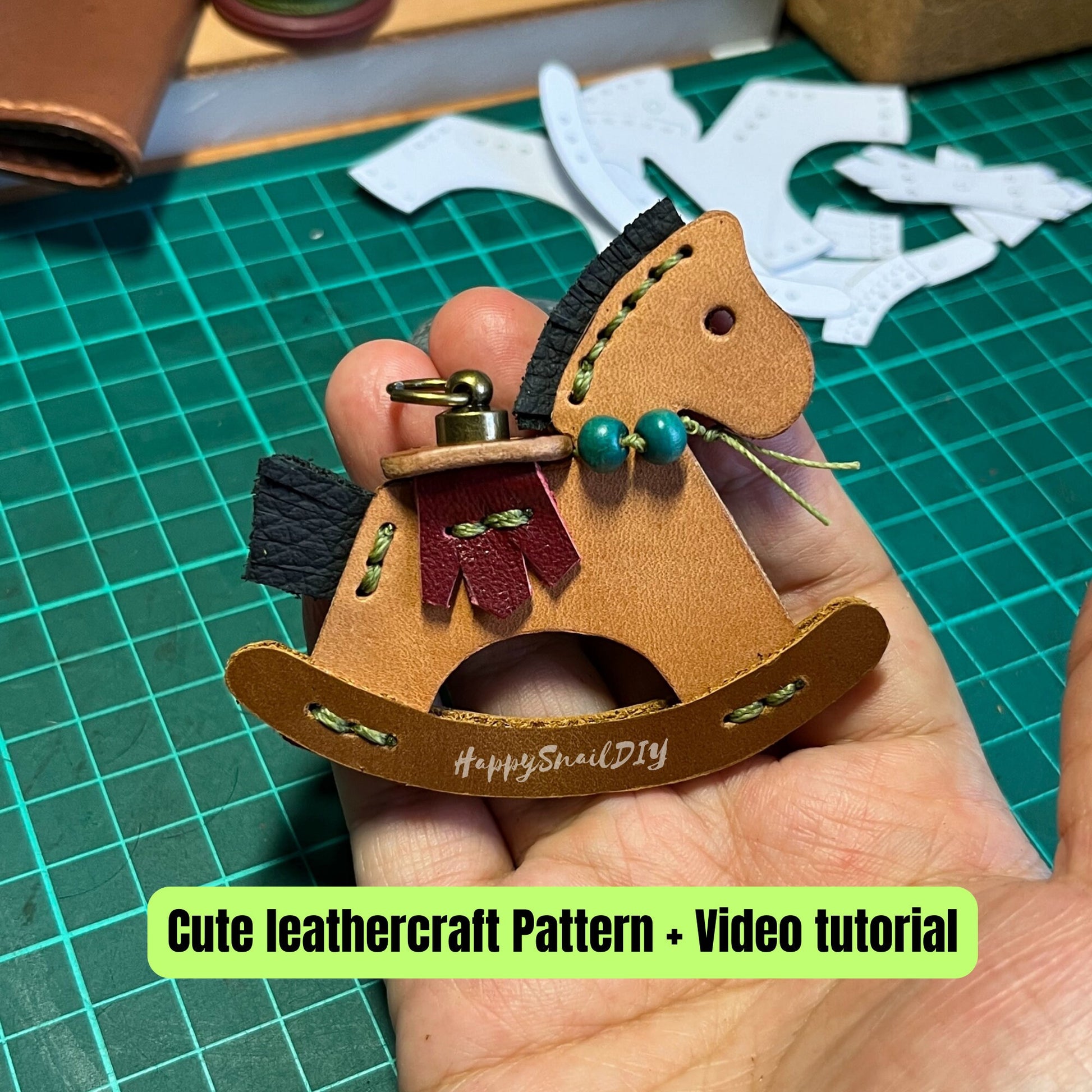 Simple yet elegant leather horse head silhouette keychain in caramel brown.