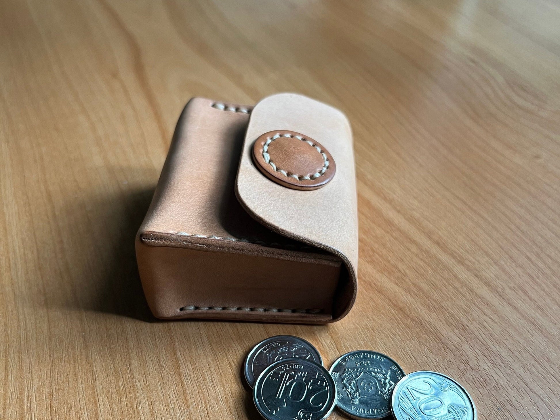 Small budget bag made from odd-shaped leather scraps.