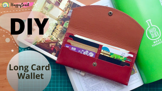 Long leather card wallet with snapping button closure front view