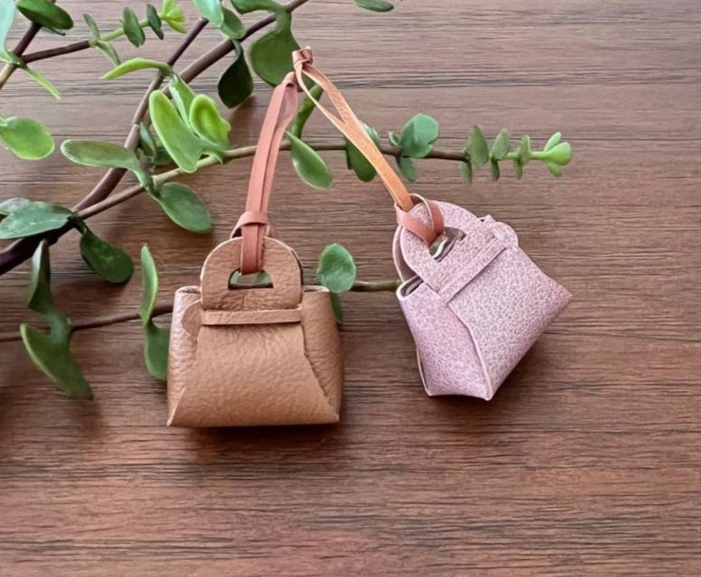 leather no-sew bag charm pouch hanging on a larger bag