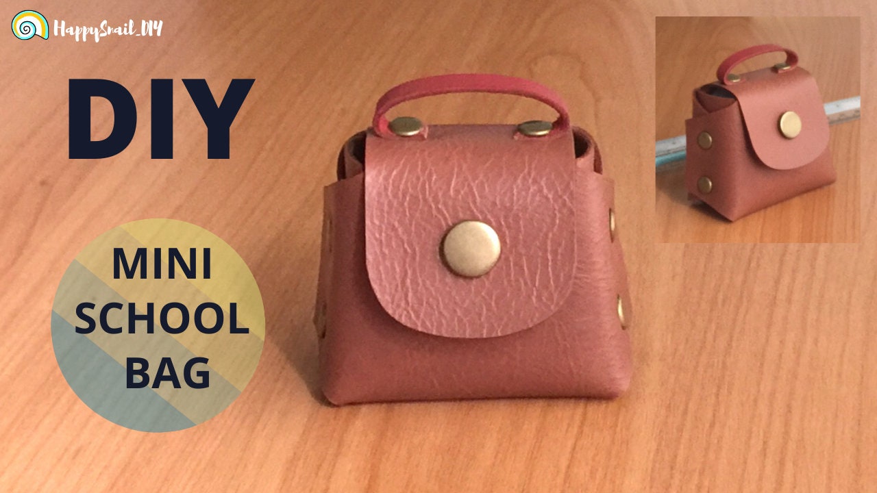 Finished miniature leather mini bag accessory made from a downloadable PDF pattern.