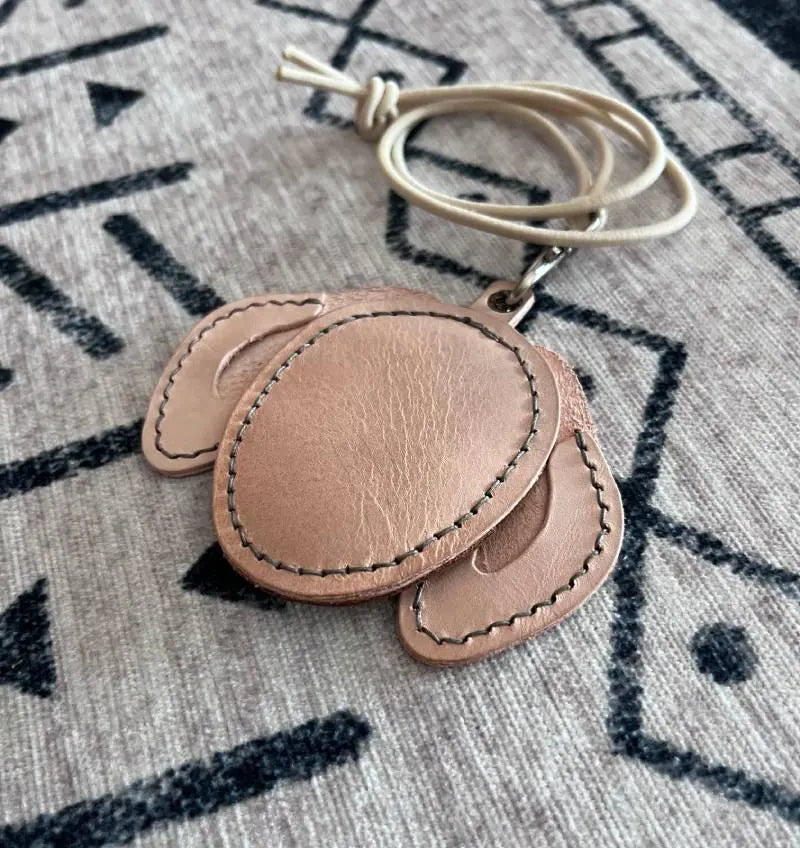 Minimalist tan leather Golden Retriever silhouette used as a sentimental pet memorial gift.