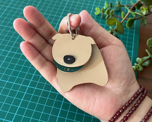 Two-tone leather dog keychain made from natural vegetable-tanned leather scraps.