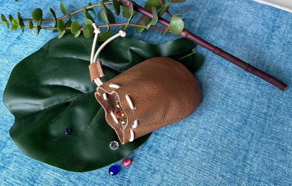 Vintage-style brown leather coin purse made from a printable PDF pattern.